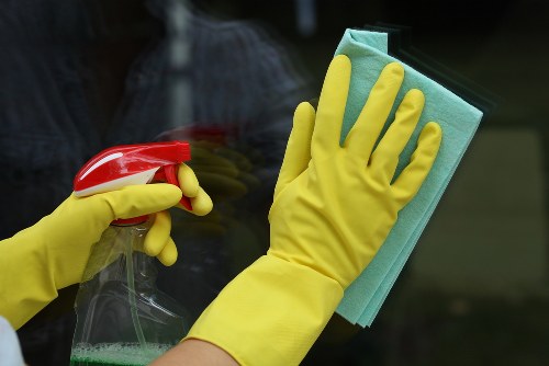 Carpet cleaners working on a fitted carpet in E17